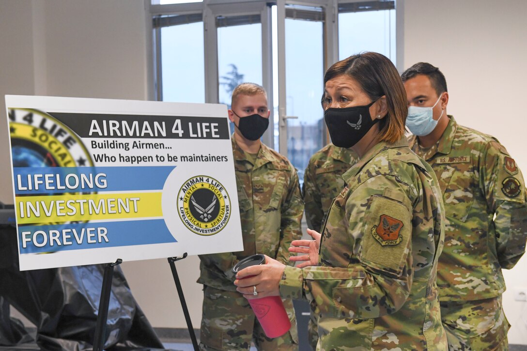 Chief Master Sergeant of the Air Force JoAnne S. Bass listens to a brief about the 31st Fighter Wing’s Airman 4 life program and receives a tour of the Comprehensive Operational Medicine for Battle Ready Airmen (COBRA) Clinic at Aviano Air Base, Italy, Dec. 23, 2020. During the tour of the clinic, Airmen briefed leadership on their areas of expertise, while focusing on how Airmen are thinking of creative ways to improve their community’s quality of life. (U.S. Air Force photo by Staff Sgt. Valarie Halbert)