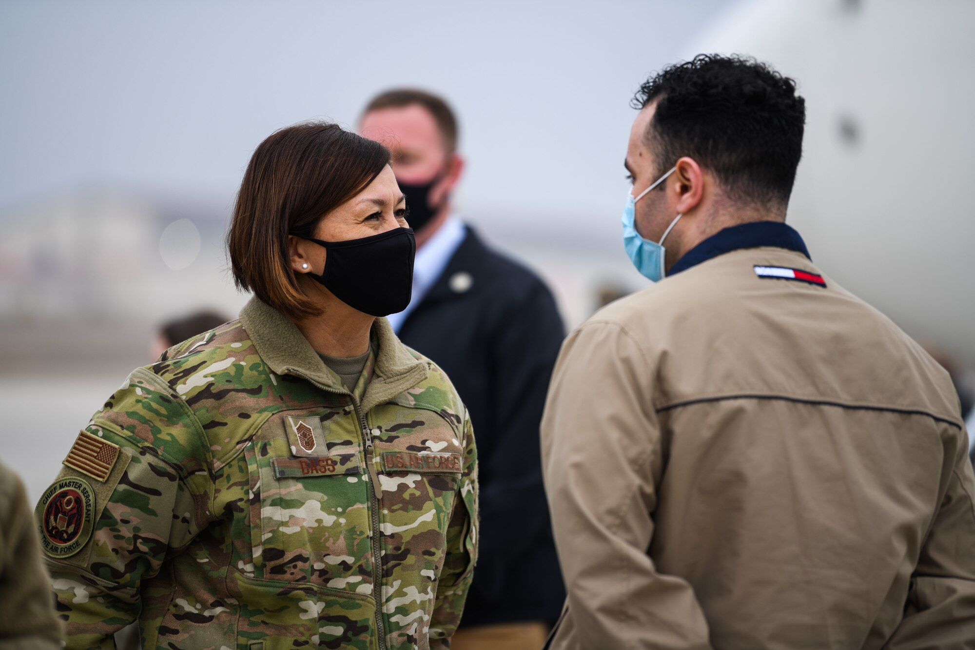 Chief Master Sergeant of the Air Force JoAnne S. Bass bids farewell to a member from the 31st Fighter Wing before she departs Aviano Air Base, Italy, Dec. 23, 2020. During her visit she listened to 31st FW mission briefs and coined multiple exceptional Airmen. (U.S. Air Force photo by Airman 1st Class Ericka A. Woolever)