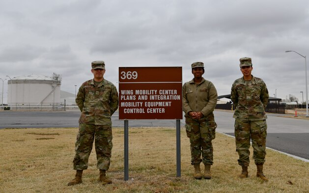 97th Logistics Readiness Squadron Installation Deployment Readiness Center Airmen pose for a photo.
