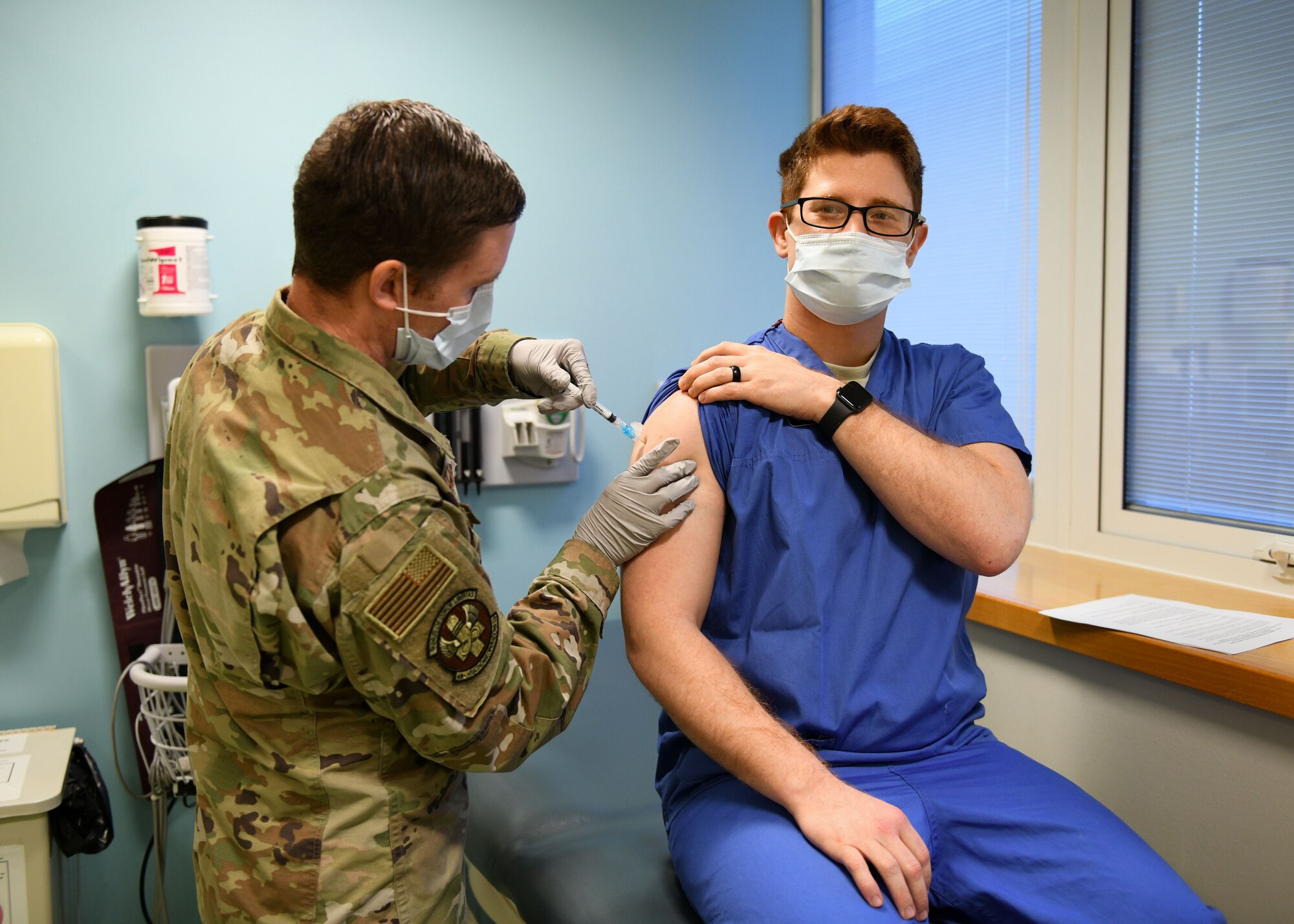 Airman 1st Class Connor Sams, 48th Medical Group technician, receives the COVID-19 vaccine at Royal Air Force Lakenheath, England, Dec.29, 2020. The arrival of the vaccine paves the way for a phased vaccine distribution plan to protect our communities against COVID-19. (U.S. Air Force photo by Senior Airman Madeline Herzog)