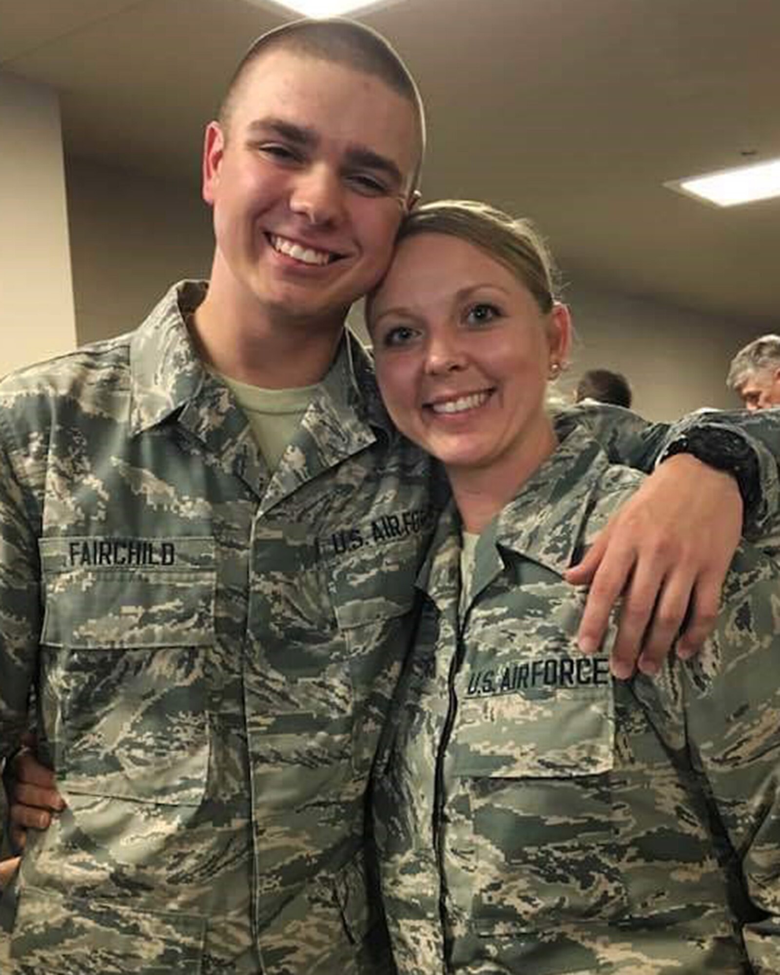 Senior Airman Amanda Guzman, personnel systems management assistant, 445th Force Support Squadron and her son, Senior Airman Stanley Fairchild III, 89th Airlift Squadron loadmaster, pose for a photo at the 445th Airlift Wing. The mother and son attended Basic Military Training at Lackland Air Force Base, Texas and graduated Oct. 25, 2019.