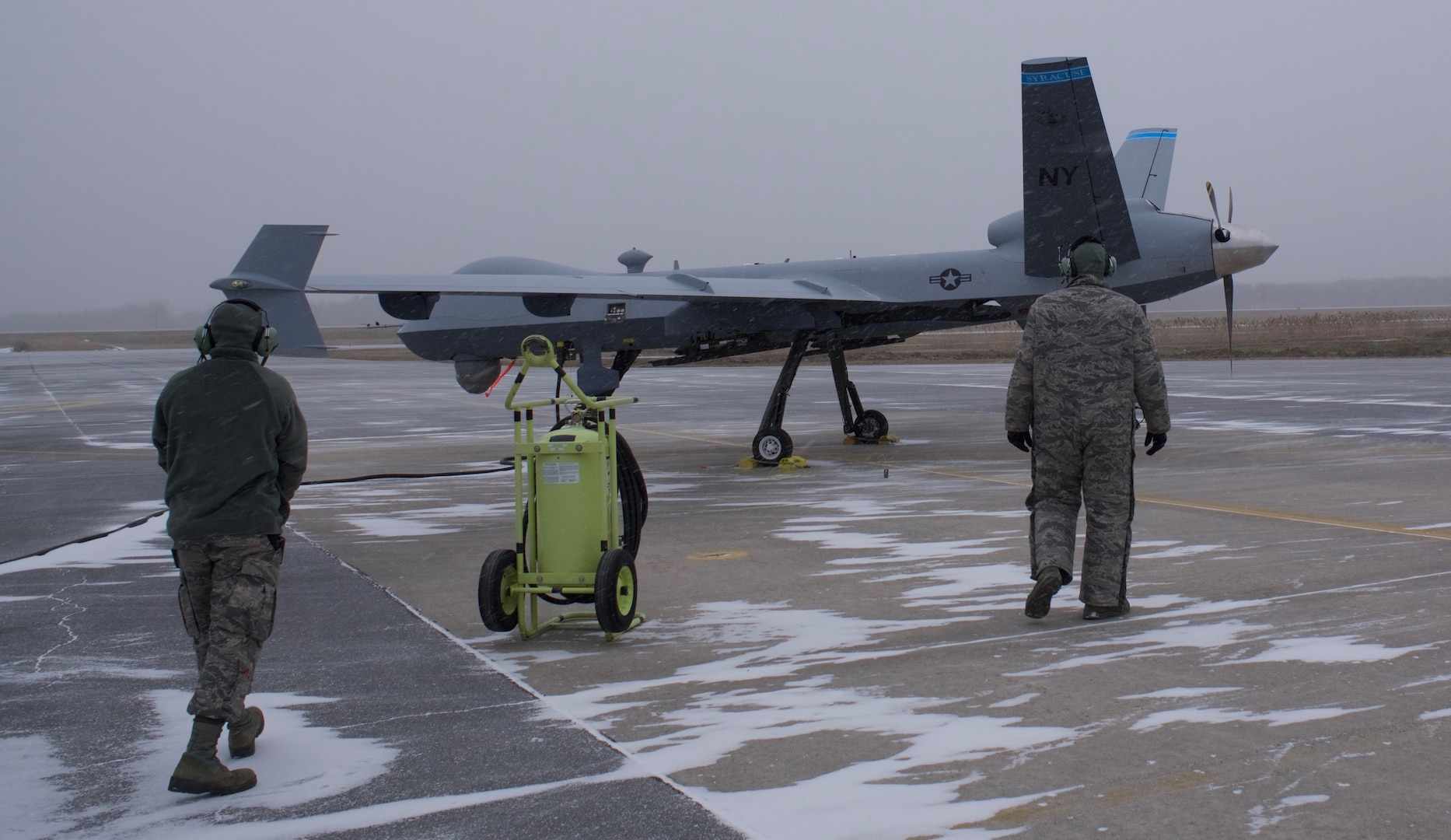 Members of the 174th Maintenance Group prepare to taxi the first Block 5 MQ-9 Reaper on Feb., 12, 2019, at Hancock Field Air National Guard Base in  Syracuse, N.Y. A Block 5 is an updated version of the MQ-9 that allows upgraded  communication and electrical systems.