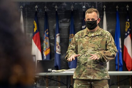 Brig. Gen. Mark S. Bennett, U.S. Army Financial Management Command commanding general, congratulates USAFMCOM Army Financial Services employees on their work in closing out fiscal year 2020 at the Maj. Gen. Emmett J. Bean Federal Center in Indianapolis Sept. 30, 2020. USAFMCOM supported year-end closeout operations across the Army from a newly setup command center with special precautions in place to protect employees during the Coronavirus (COVID-19) pandemic. (U.S. Army photo by Mark R. W. Orders-Woempner)