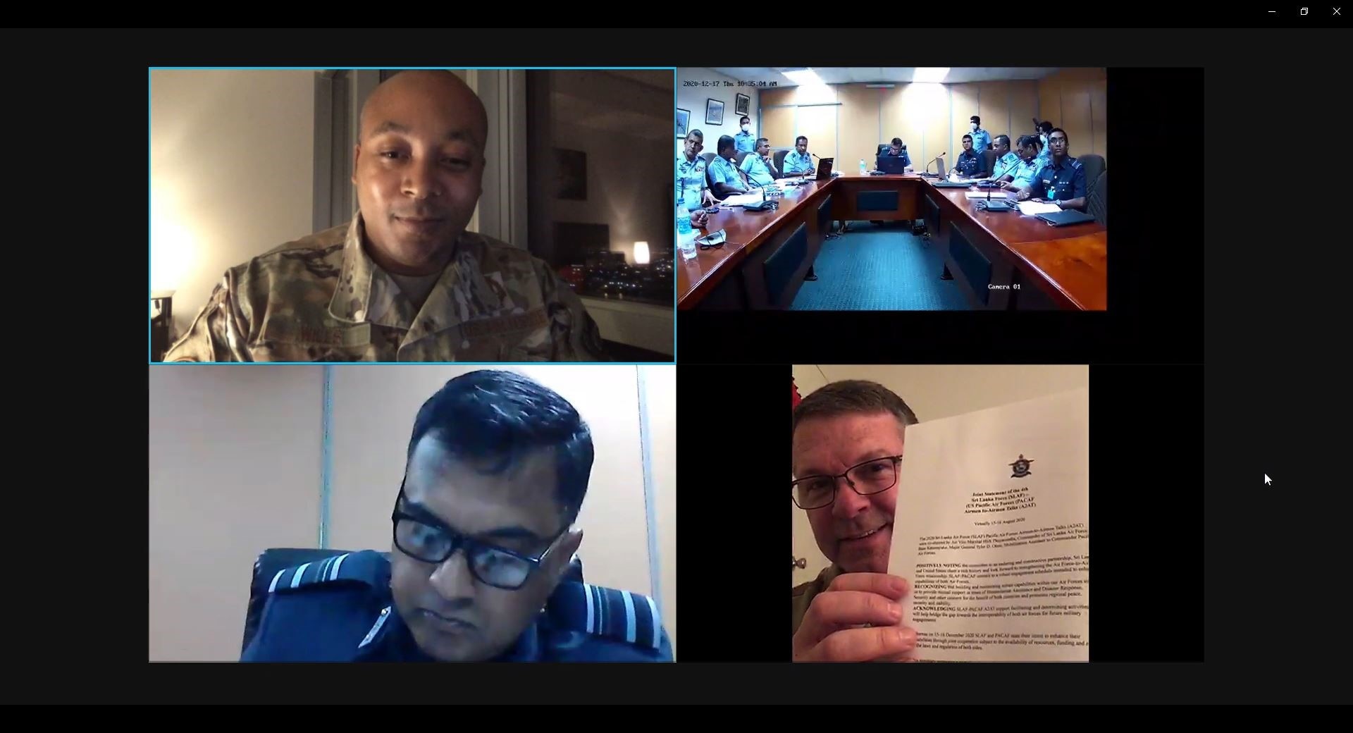 U.S. Air Force Maj. Nathan Wills, PACAF Directorate of Strategic Plans and Policy, top left, and members of the Sri Lankan Air Force (SLAF), top right, watch as SLAF Director of Training Air Vice Marshal HSS Thuyacontha, bottom left, and U.S. Air Force Maj. Gen. Tyler Otten, mobilization assistant to the Pacific Air Forces commander, bottom right, partake in a ceremonial minutes signing commemorating a successful first virtual and fourth annual Airmen-to-Airmen Talk hosted from Hickam Air Force Base, Hawaii, Dec. 15, 2020. During A2ATs, PACAF and partner nations sharpen interoperability by sharing best practices in a multitude of subject matter areas.