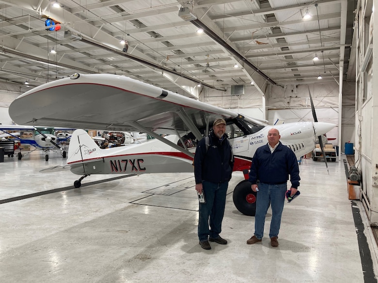 CubCrafters pilot Mark Keneston (left) and Air Force Research Laboratory pilot Dr. Eric Geiselman are pictured next to AFRL LASH Lysander XCub at the Lewis A. Jackson Regional Airport in Greene County, Ohio, on Dec. 21, 2020. The aircraft made a brief stop before traveling on to the AFRL 711th Human Performance Wing's contracted research flight test organization facility in Maryland, where it will be used to advance the initial 