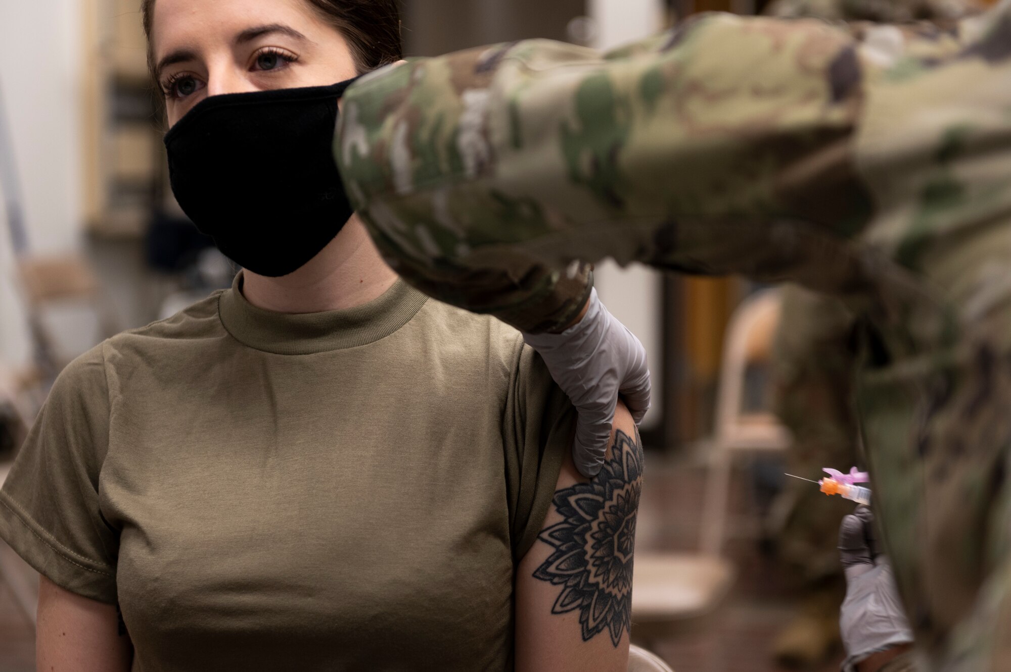 a military member receives the COVID-19 vaccine