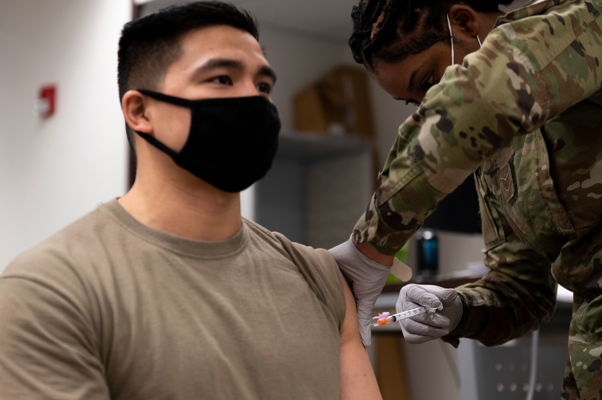 A military member receives the COVID-19 vaccine