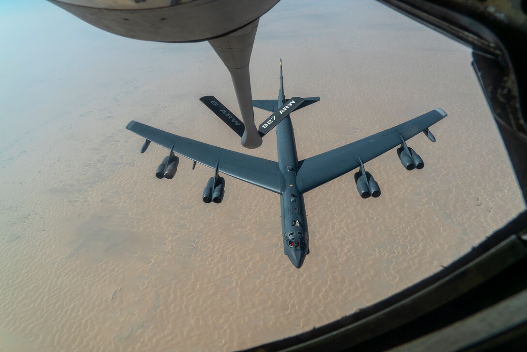 A U.S. Air Force B-52 from Minot Air Force Base departs after aerial refueling from a KC-135 Stratotanker in the U.S. Central Command area of responsibility Dec. 30, 2020. The B-52 Stratofortress is a long-range, heavy bomber that is capable of flying at high subsonic speeds at altitudes of up to 50,000 feet and can carry nuclear or precision guided conventional ordnance with global reach precision navigation capability. (U.S. Air Force photo by Senior Airman Roslyn Ward)