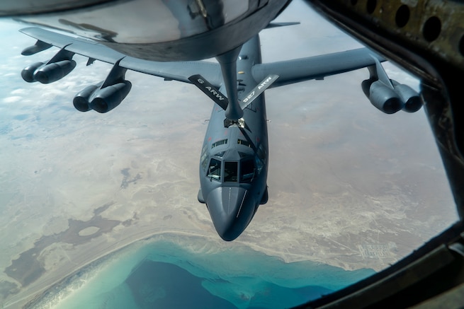 A U.S. Air Force B-52 from Barksdale Air Force Base is aerial refueled by a KC-135 Stratotanker over the U.S. Central Command area of responsibility Dec. 30, 2020. The B-52 Stratofortress is a long-range, heavy bomber that is capable of flying at high subsonic speeds at altitudes of up to 50,000 feet and can carry nuclear or precision guided conventional ordnance with global reach precision navigation capability. (U.S. Air Force photo by Senior Airman Roslyn Ward)