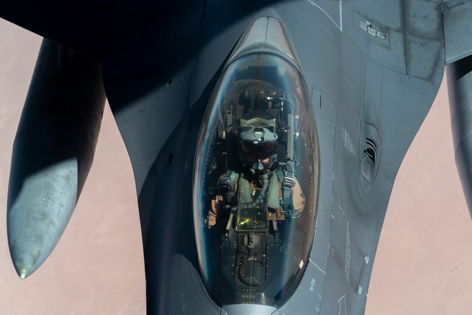U.S. Air Force F-16 Fighting Falcon is aerial refueled by a KC-135 “Stratotanker” over the U.S. Central Command area of responsibility Dec. 30, 2020 as part of an escort mission in support of the B-52 “Stratofortress” deployment. The short-notice deployment underscores the U.S. military's commitment to regional security and demonstrates a unique ability to rapidly deploy overwhelming combat power on short notice.  The B-52H is a long-range, heavy bomber that is capable of flying at high subsonic speeds at altitudes of up to 50,000 feet and provides the United States with immediate global strike capability.  (U.S. Air Force photo by Senior Airman Roslyn Ward)