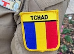 The Republic of Chad flag is shown on the uniform of one of the first two women in that service to become a pilot. They are attending General English Training at the Defense Language Institute English Language Center, Joint Base San Antonio-Lackland.