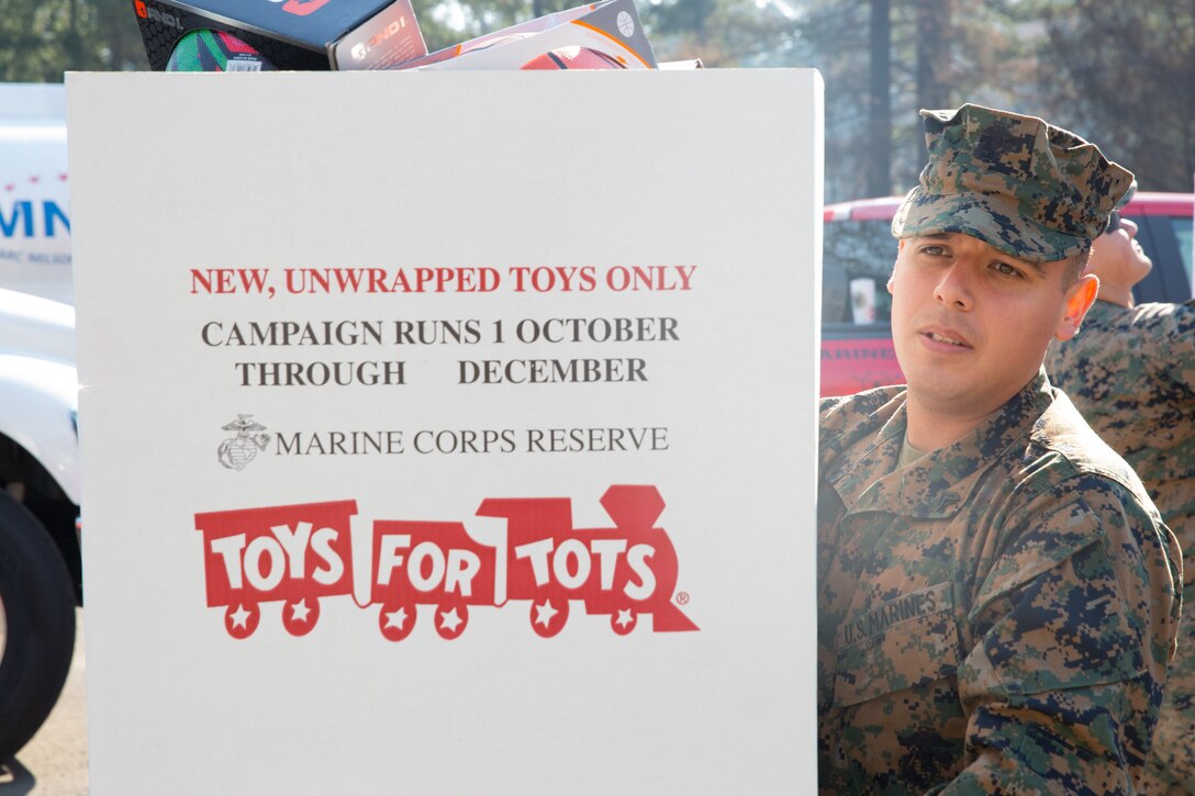 U.S. Marine Corps Cpl. Daniel Diosdado, an administrative clerk with Recruiting Station Portland, unloads a truck at the relief center in Gates, Oregon, Sept. 30, 2020. Recruiting Station Portland partnered with the Woman Marines Association in Oregon to deliver toys and school supplies to children who lost their homes in the wildfires across Oregon. (U.S. Marine Corps photo by Sgt. Samantha Bray)