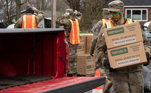 Vermont National Guard soldiers load Meals, Ready-to-Eat into a Vermont resident's car at Folsom Elementary School in South Hero, Vermont, May 1, 2020. The outreach program, in partnership with the Federal Emergency Management Agency and the Vermont Foodbank, is part of Vermont's whole-of-government effort to flatten the curve of the COVID-19 pandemic and help Vermonters affected economically.