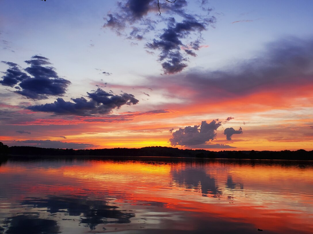 Photo shows a vibrant and colorful sunset at Blue Marsh Lake