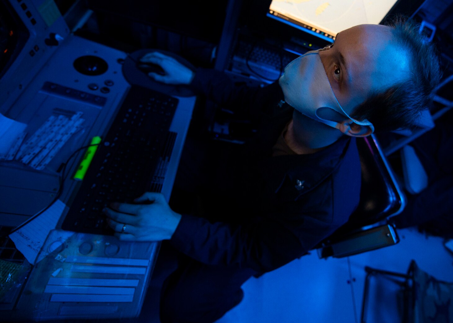 TAIWAN STRAIT (Dec. 30, 2020) Cryptologic Technician (technical) 2nd Class Christian PriceGlunz, from Littleton, Colorado, operates a console in the combat information center as guided-missile destroyer USS Curtis Wilbur (DDG 54) conducts routine operations. Curtis Wilbur is forward-deployed to the U.S. 7th Fleet area of operations in support of a free and open Indo-Pacific.