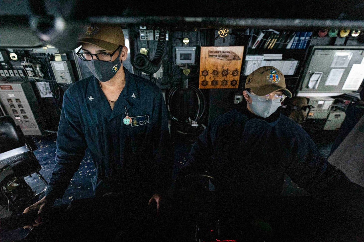 TAIWAN STRAIT (Dec. 30, 2020) Boatswain’s Mate 3rd Class Jonni Melo, left, from Bronx, New York, and Boatswain’s Mate 3rd Class Nicole Zapata, from Tampa, Florida, stand watch in the pilot house aboard guided-missile destroyer USS John S. McCain (DDG 56) while the ship conducts routine underway operations in support of stability and security for a free and open Indo-Pacific.