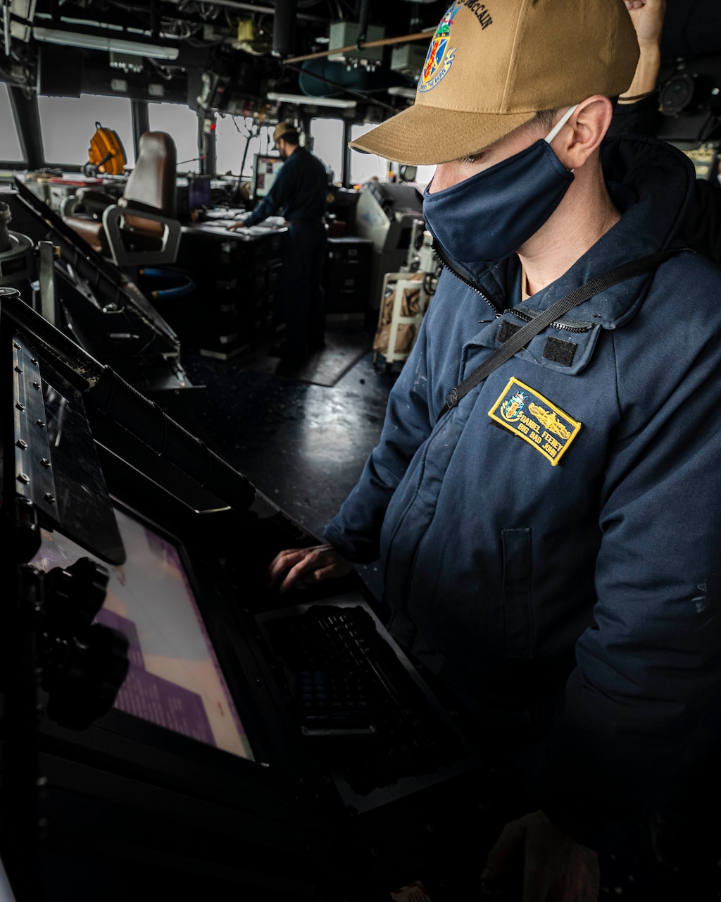 TAIWAN STRAIT (Dec. 30, 2020) Navigator Lt. j.g. Daniel Feeney, from Old Greenwich, monitors the ship’s course on the voyage management system (VMS) while standing watch in the pilot house as the guided-missile destroyer USS John S. McCain (DDG 56) conducts routine underway operations in support of stability and security for a free and open Indo-Pacific.