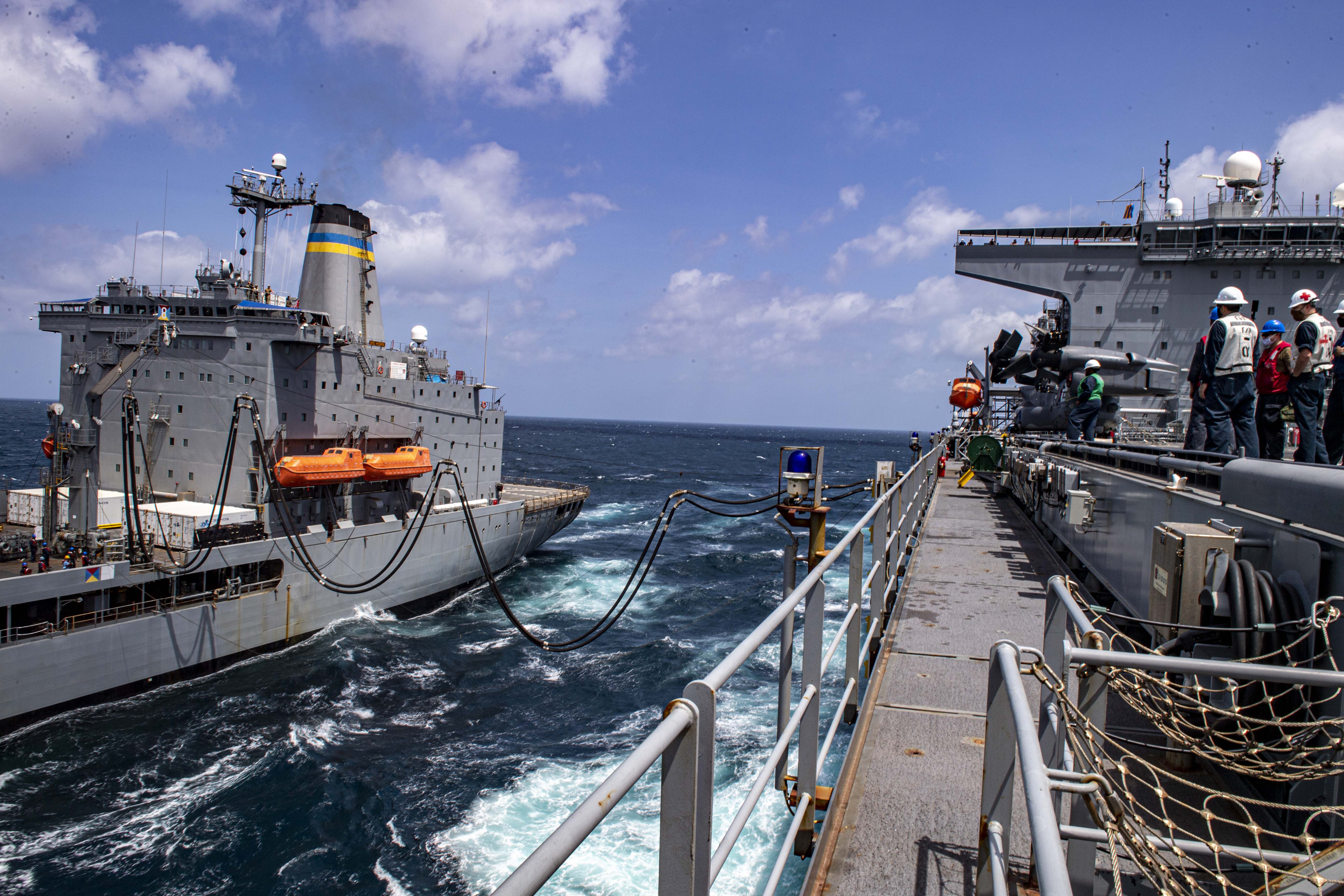 The Expeditionary Sea Base USS Hershel "Woody" Williams, right, conducts a fueling-at-sea with the fleet replenishment oiler USNS Big Horn (T-AO 198).