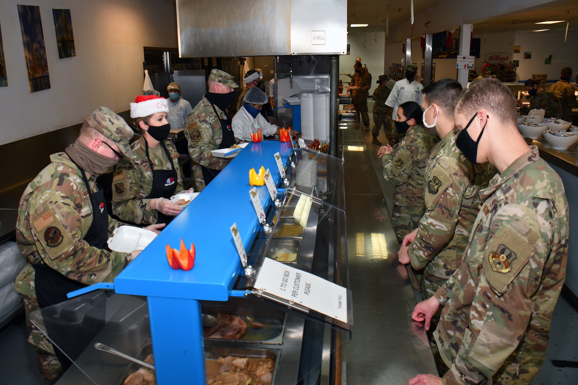 people stand in a food service line