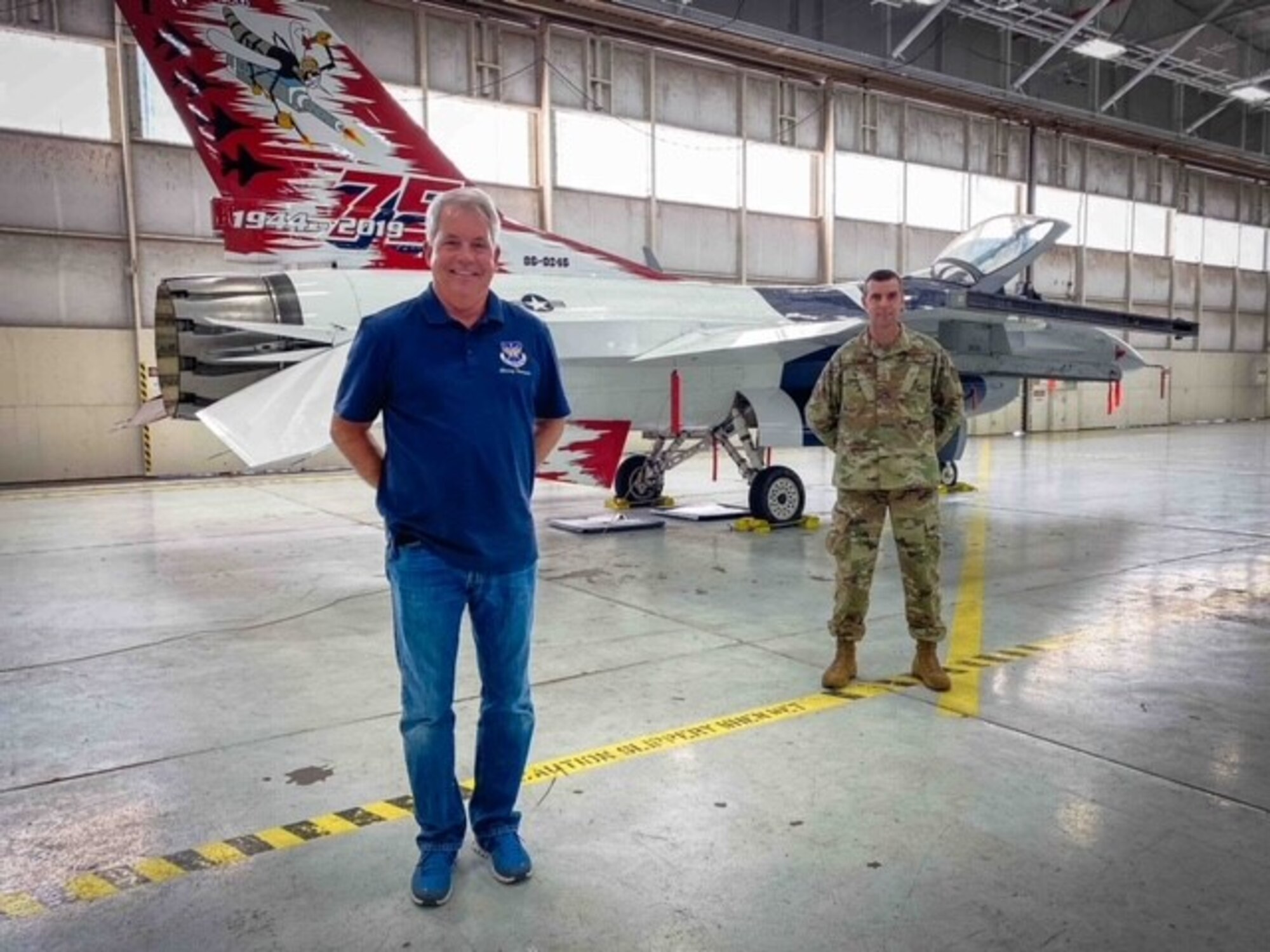 (Left) 301st Fighter Wing Honorary Command Chief Rob Klint stands with 301st Fighter Wing Command Chief Master Sgt. Michael Senigo in front of the wing’s heritage F-16 jet at U.S. Naval Air Station Joint Reserve Base Fort Worth, Texas on December 21, 2020. The honorary commander program aims to foster relationships between the wing and the community members it serves through communication, education, experiences and getting to know the wing’s Airmen. (U.S. Air Force photo by Capt. Jessica Gross)