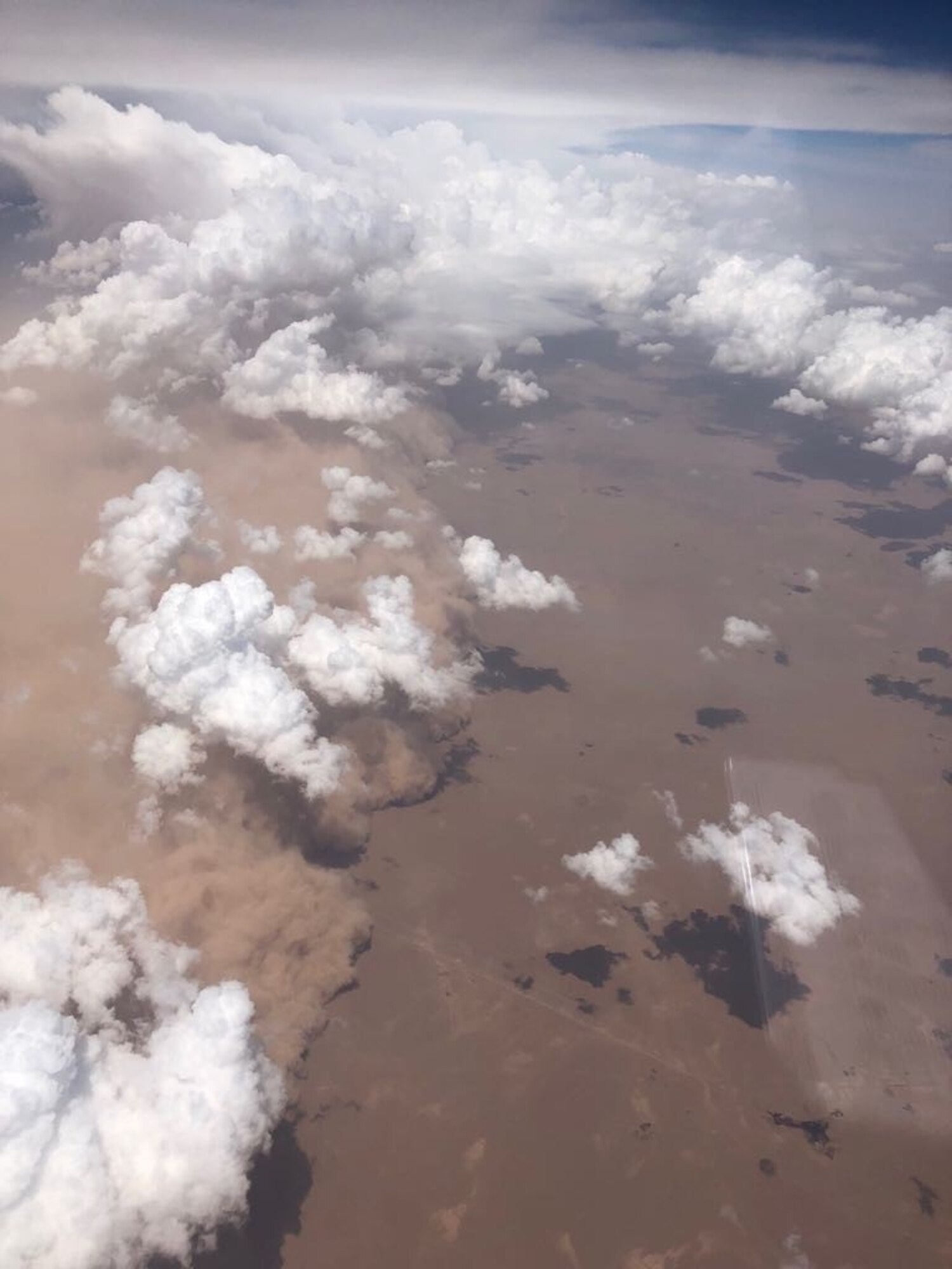 An aerial view of a dust storm approaching the 407th Air Expeditionary Group, Ahmad al-Jaber Air Base, Kuwait in 2018. (Courtesy photo from Col. Nathan Aysta)