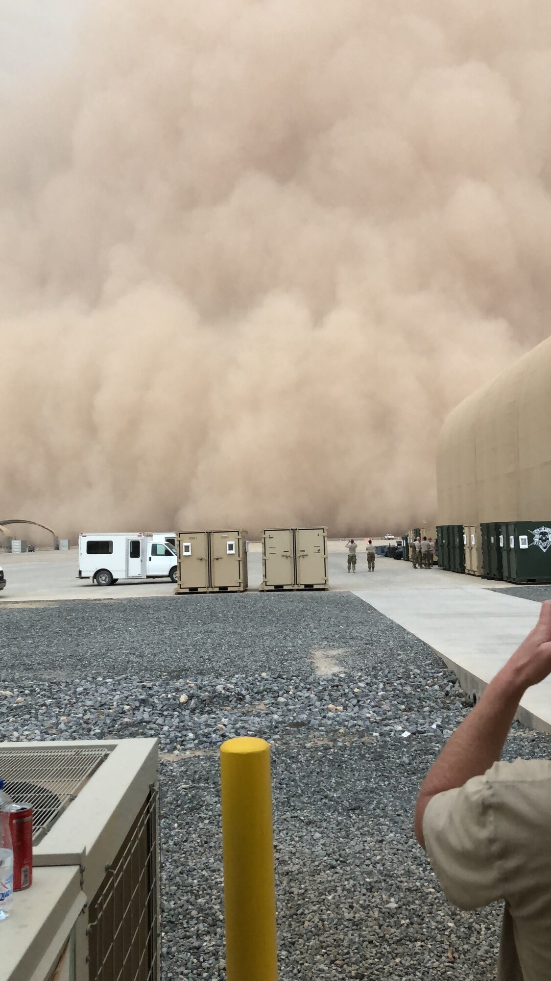 A dust storm approaches the work areas of deployed Airmen at the 407th Air Expeditionary Group, Ahmad al-Jaber Air Base, Kuwait in 2018. (Courtesy photo from Chief Master Sgt. Ryan Gigliotti)