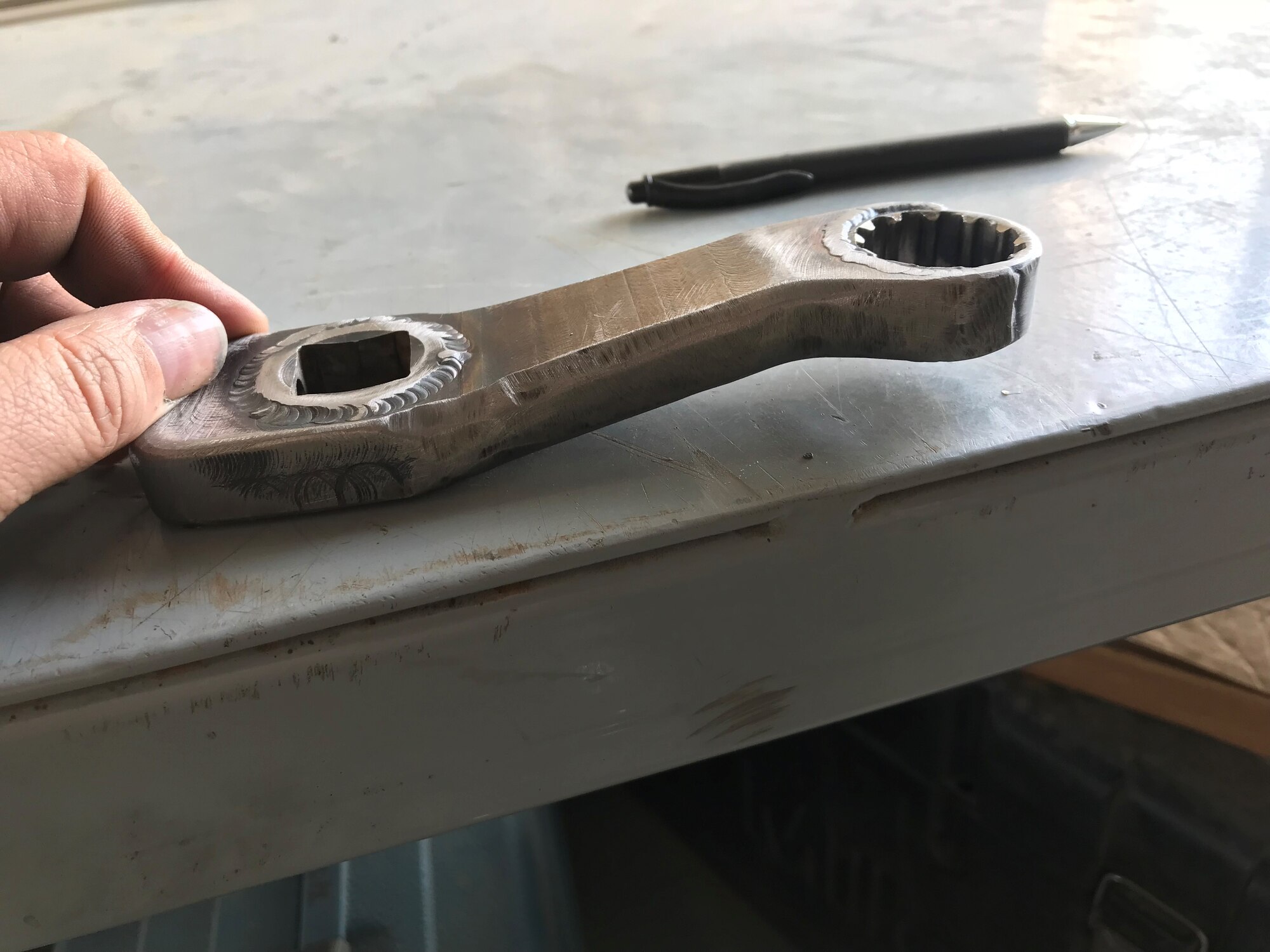 Aircraft metals technology craftsmen from the 148th Fighter Wing designed and fabricated tools, like this dog-leg wrench which was not available commercially, during a deployment to the 407th Air Expeditionary Group, Ahmad al-Jaber Air Base, Kuwait in 2018.