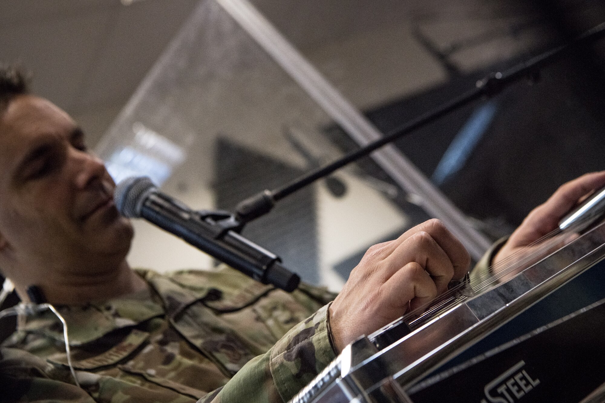 man plays steel guitar