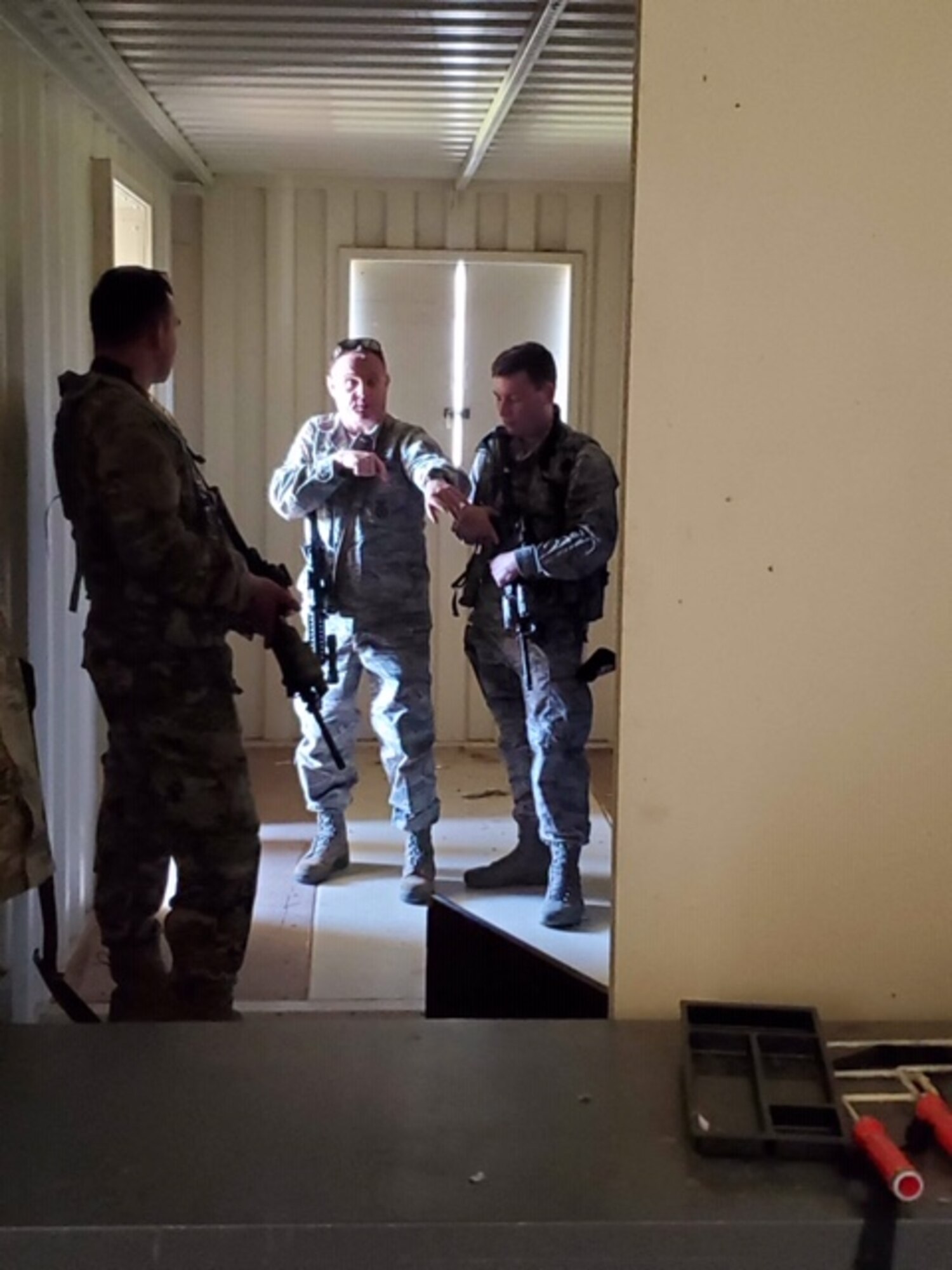 Genesis training program students from the 940th Security Forces Squadron receive a briefing on how to properly enter a building in spring 2020 at Beale Air Force Base, California.