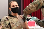 U.S. Army Health Clinic Hohenfels conducted its first inoculations of healthcare workers and first responders with the Moderna COVID-19 vaccine at the Hohenfels movie theater, Hohenfels Training Area, Germany, Dec. 31, 2020. Lt. Col. Laura Jeffrey, USAHC Hohenfels clinic commander and registered nurse, was first to receive the vaccine in the Hohenfels military community.