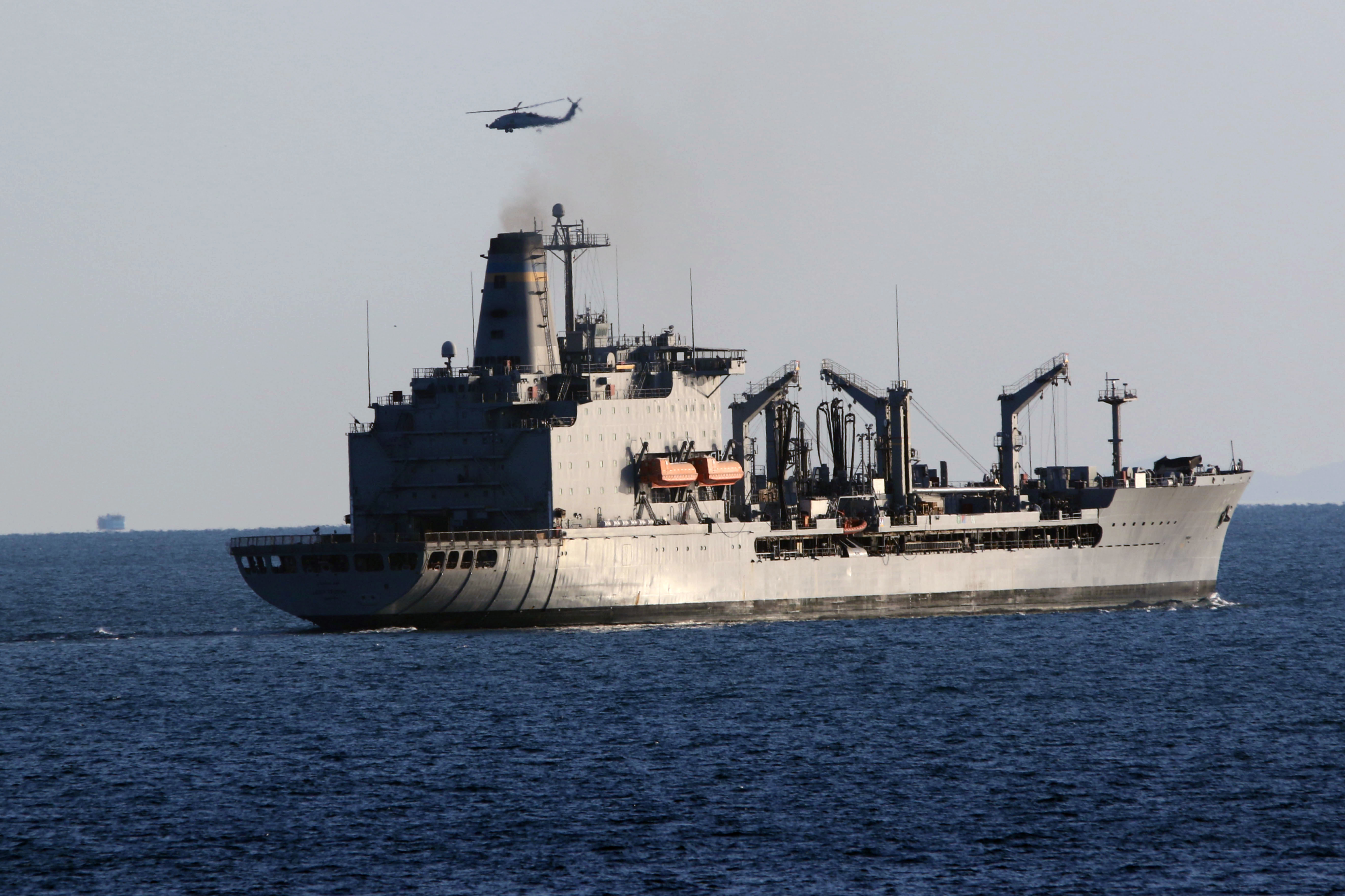 The Military Sealift Command fleet replenishment oiler USNS Leroy Grumman (T-AO 195) transits the Strait of Hormuz, Dec. 29.