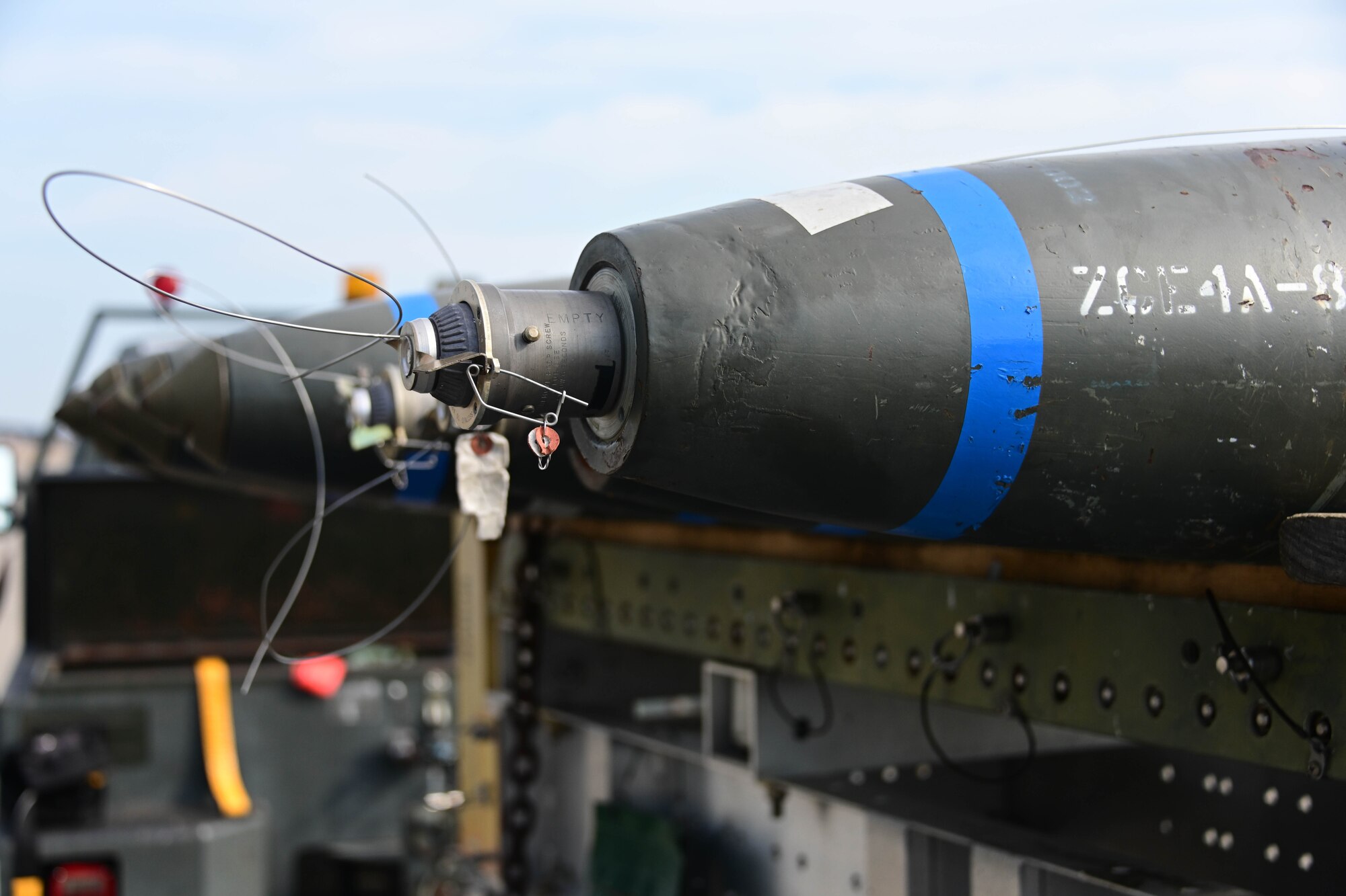 Bombs sit ready on the flight line.