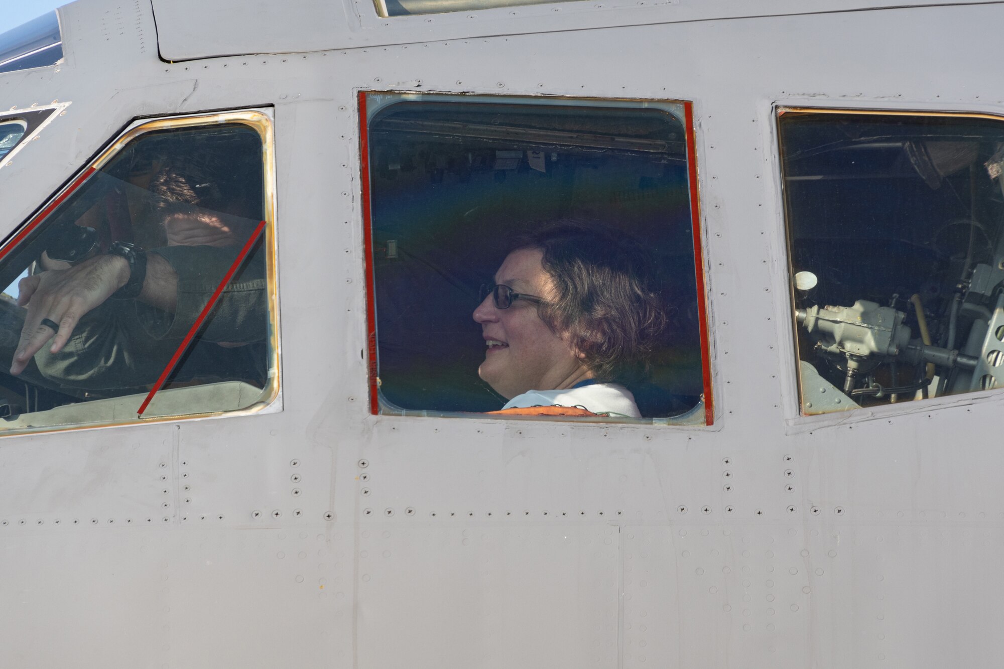 Dr. Donna Senft smiles as she tours cockpit.