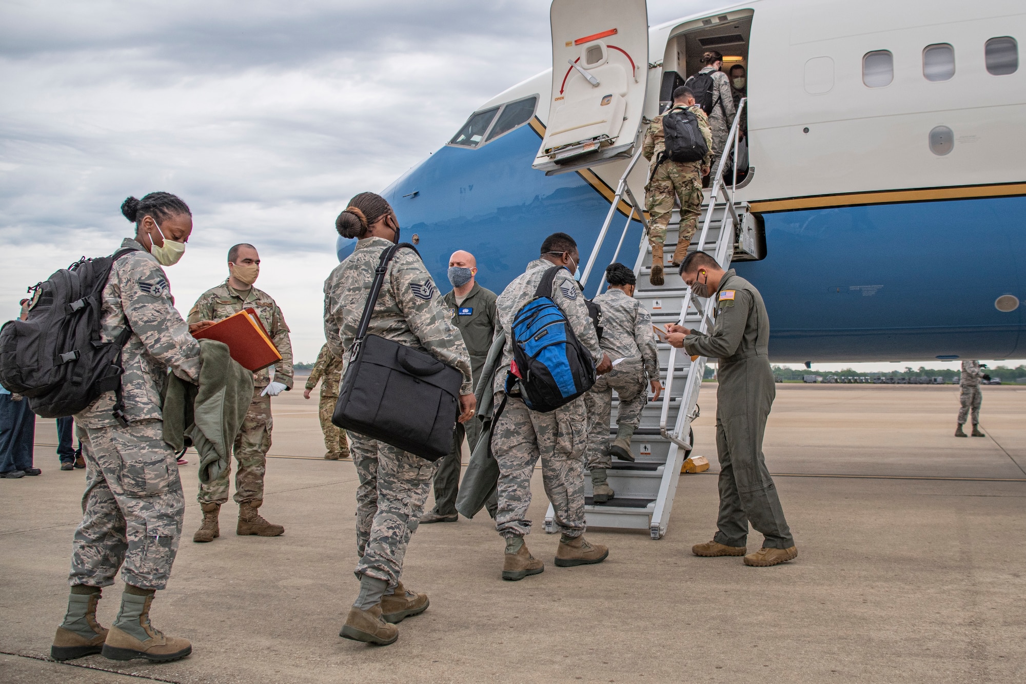 Airmen prepare to board a plane.