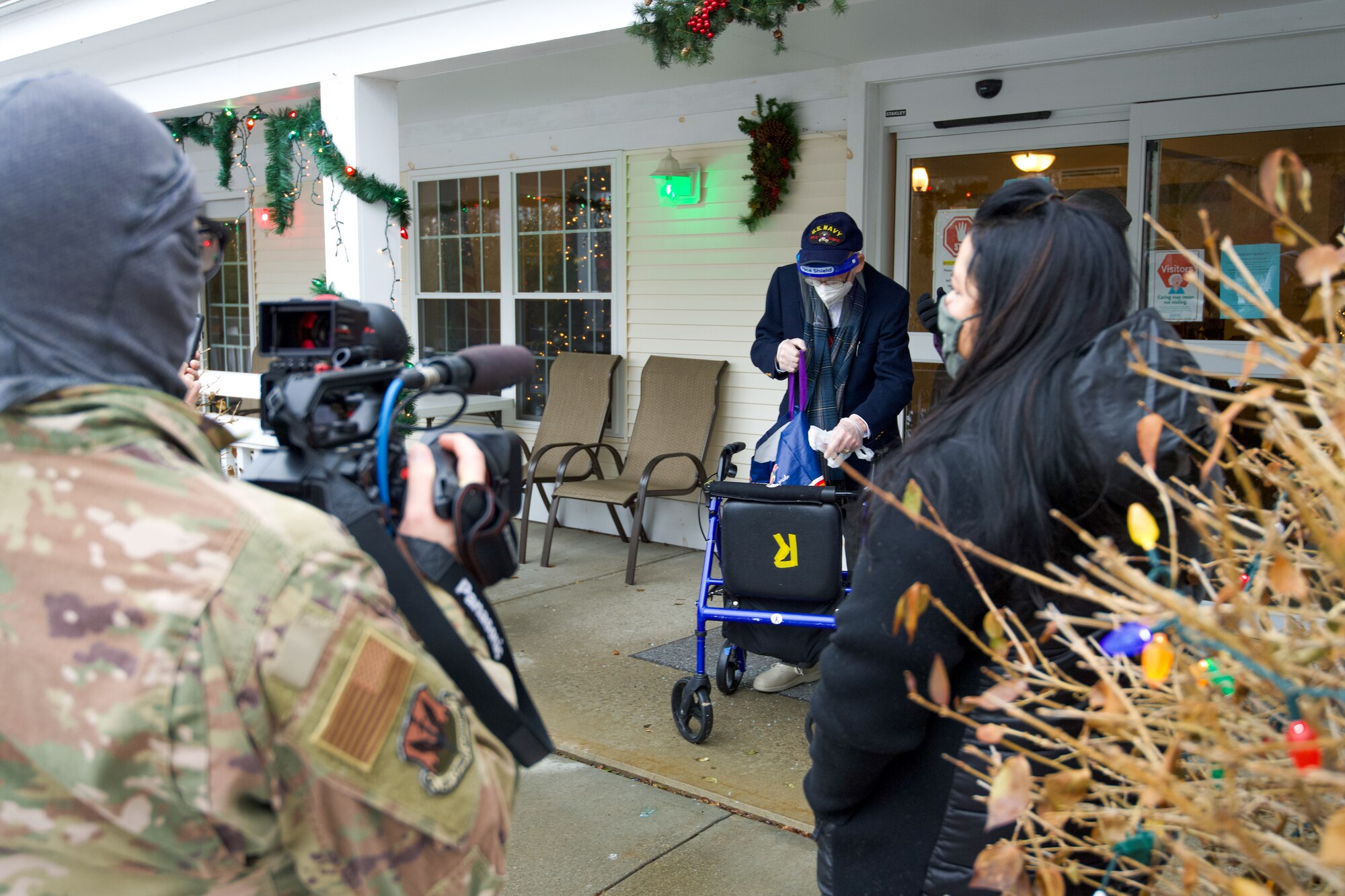 World War II veteran Lenny Roberge, Vermont’s oldest living veteran, prepares to hand out to Airmen present apple pie he baked in appreciation for receiving a flag flown in the F-35, at a small ceremony outside his nursing home in South Burlington, Vt., Dec. 22, 2020. In order to honor Roberge, Airmen from the 158th Fighter Wing had a flag flown in an F-35 during a combat training sortie over the mountains of Vermont and New York. (U.S. Air National Guard photo by Senior Master Sgt. Michael Davis)