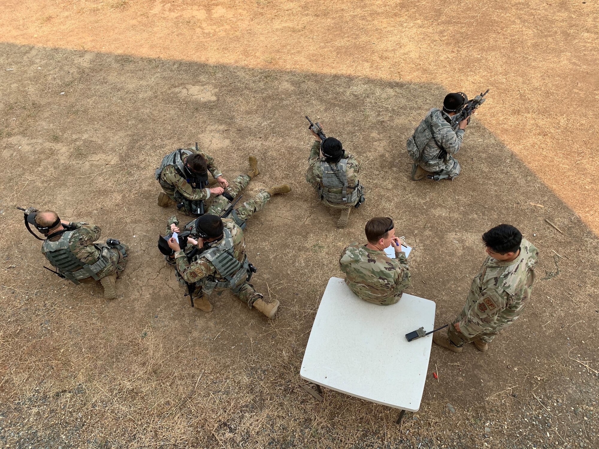 Genesis students from the 940th Security Forces Squadron train how to perform medical aid while calling a 9-line for MED-EVAC in spring 2020 at Beale Air Force Base, California.