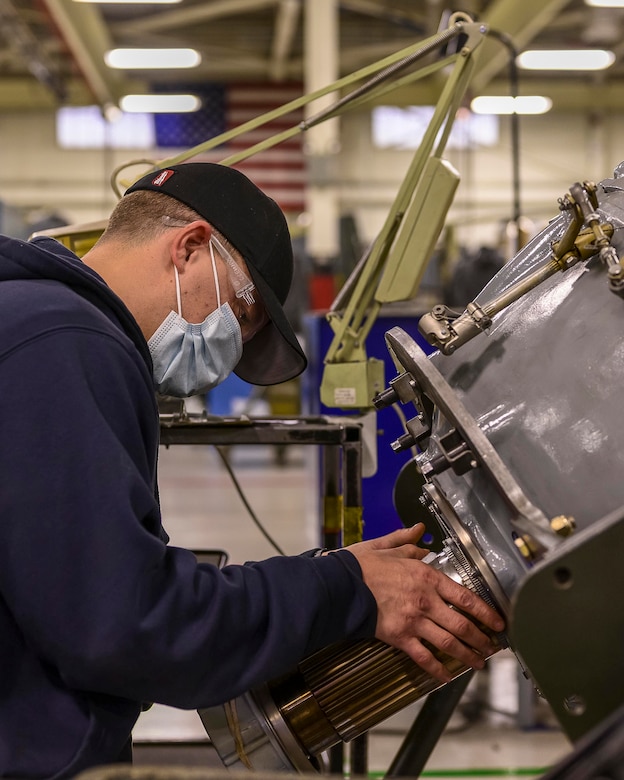 Contract Field Team member, Jon Hart, cleans and inspects an engine reduction gear box, Dec. 29, 2020, at Little Rock Air Force Base, Ark. The facility produces all C-130H Hercules 3.5 engine modifications and 54H60-117 propeller overhauls for Air Force Reserve Command  and many Air National Guard units. (U.S. Air Force Reserve photo by Maj. Ashley Walker)