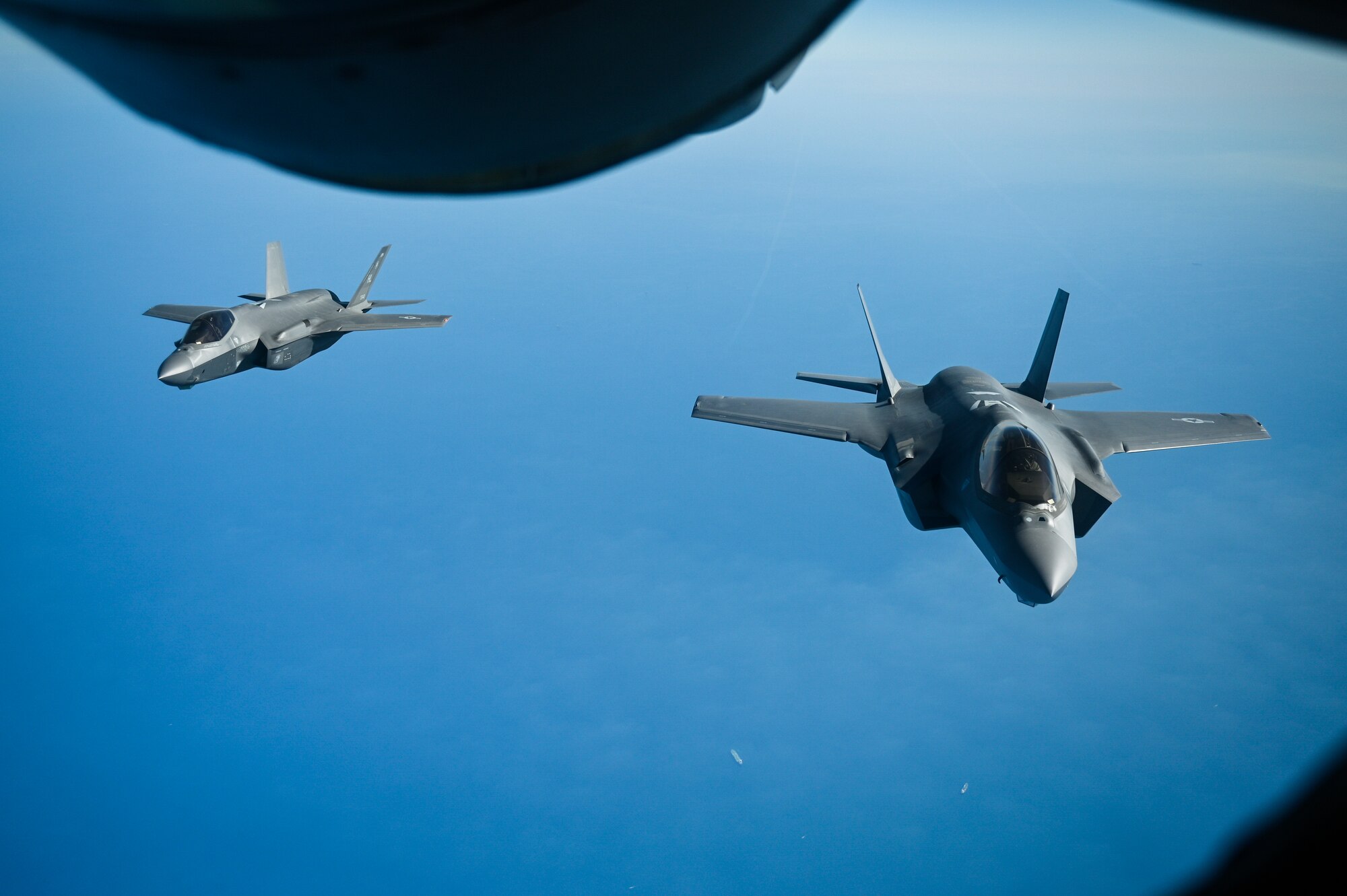 Two U.S. Air Force F-35A Lighting II's fly over the Arabian Gulf during an in-air refueling mission with a U.S. Air Force KC-135 Stratotanker assigned to the 28th Expeditionary Air Refueling Squadron, deployed to Al Udeid Air Base, Qatar, Jan. 17, 2020.