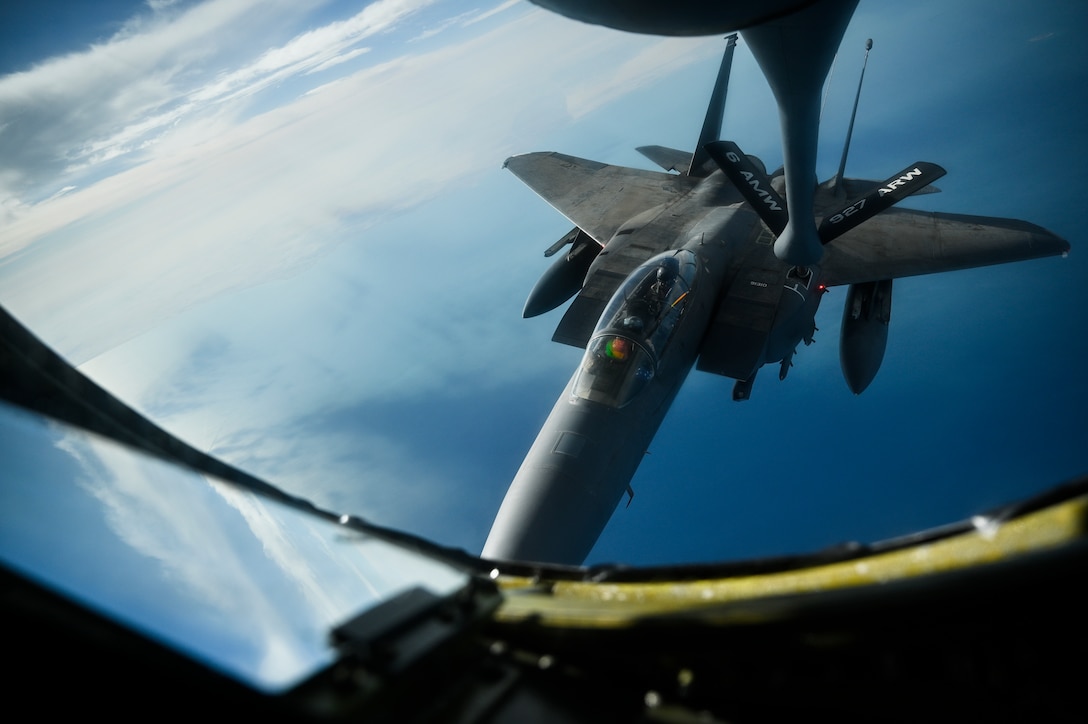 A U.S. Air Force F-15E Strike Eagle receives fuel from a U.S. Air Force KC-135 Stratotanker assigned to the 28th Expeditionary Air Refueling Squadron, deployed to Al Udeid Air Base, Qatar, WHERE, Jan. 17, 2020.