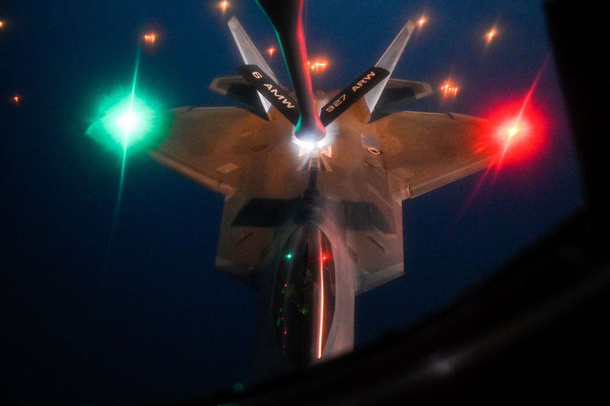 A U.S. Air Force F-22 Raptor receives fuel from a U.S. Air Force KC-135 Stratotanker assigned to the 28th Expeditionary Air Refueling Squadron, deployed to Al Udeid Air Base, Qatar, over the Arabian Gulf, Jan. 17, 2020.