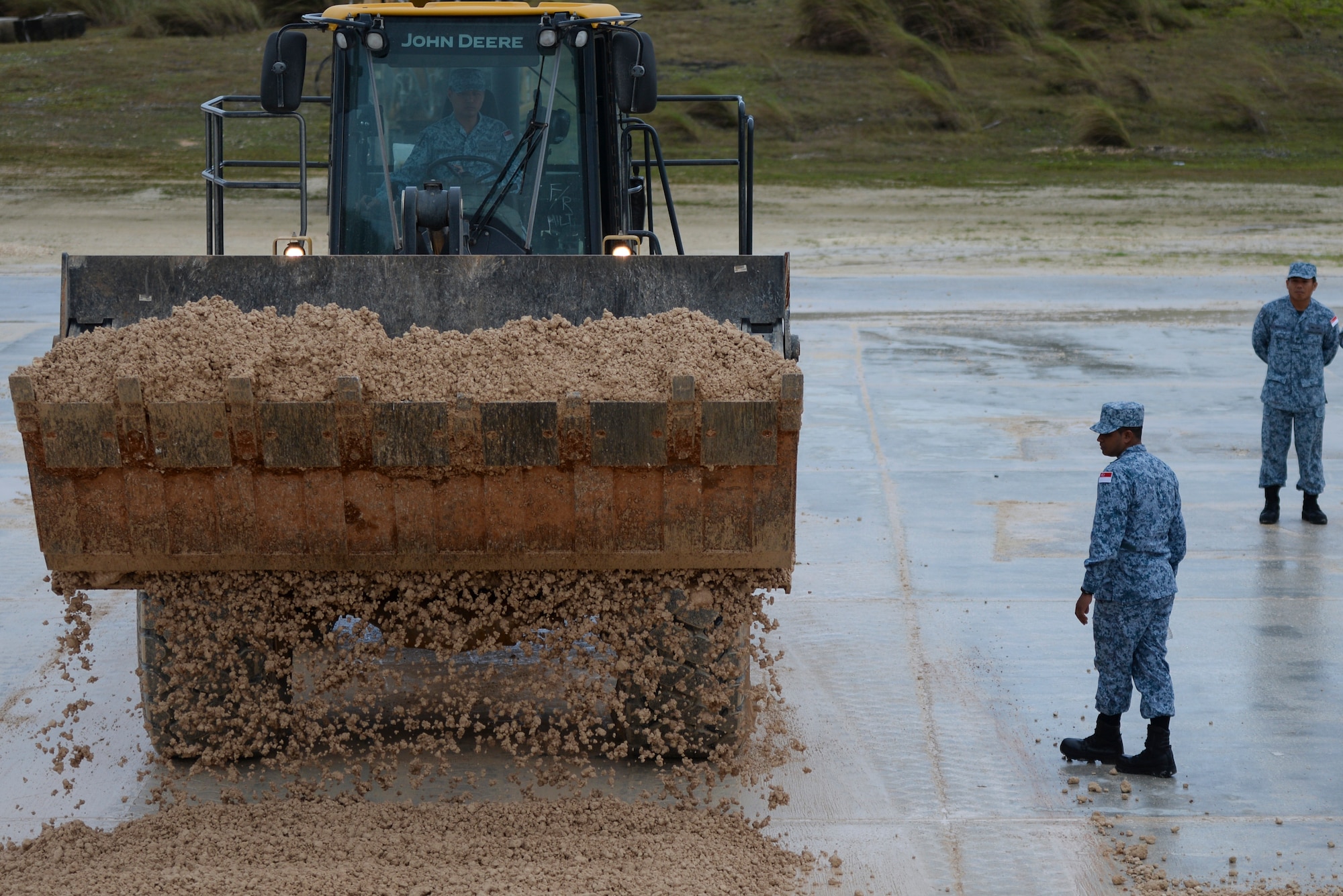Members from the Royal Singapore Air Force learn how to operate heavy duty equipment during exercise Silver Flag Jan 29, 2020, at Andersen Air Force Base, Guam.