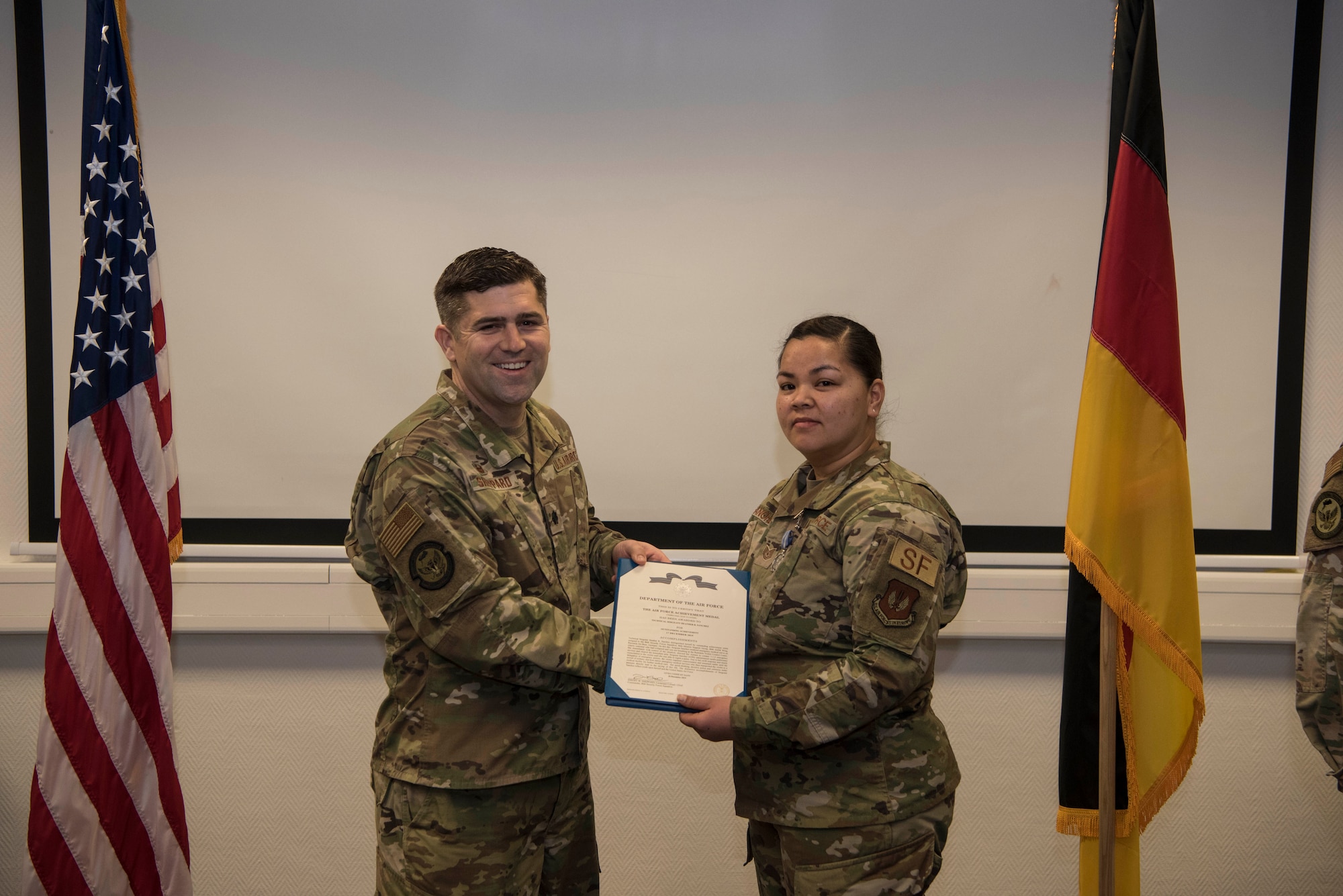 Technical Sgt. Heather R. Sanchez, 86th Security Forces Squadron Installation Access non-commissioned officer in charge, receives the U.S. Air Force Achievement Medal on Ramstein Air Base, Germany, Jan. 17, 2020. Sanchez received this award after saving the life of a mother visiting on base to see her son's place of work.