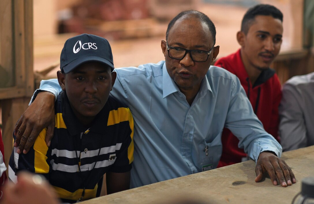 Members of the local English Discussion Group talk with U.S. military personnel at Nigerien Air Base 201, Niger, Feb. 1, 2020. Invited on base by members of the U.S. Army 443rd Civil Affairs Battalion Civil Affairs Team 219, the group continually improves their language skills by talking to native English speakers. (U.S. Air Force photo by Tech. Sgt. Alex Fox Echols III)