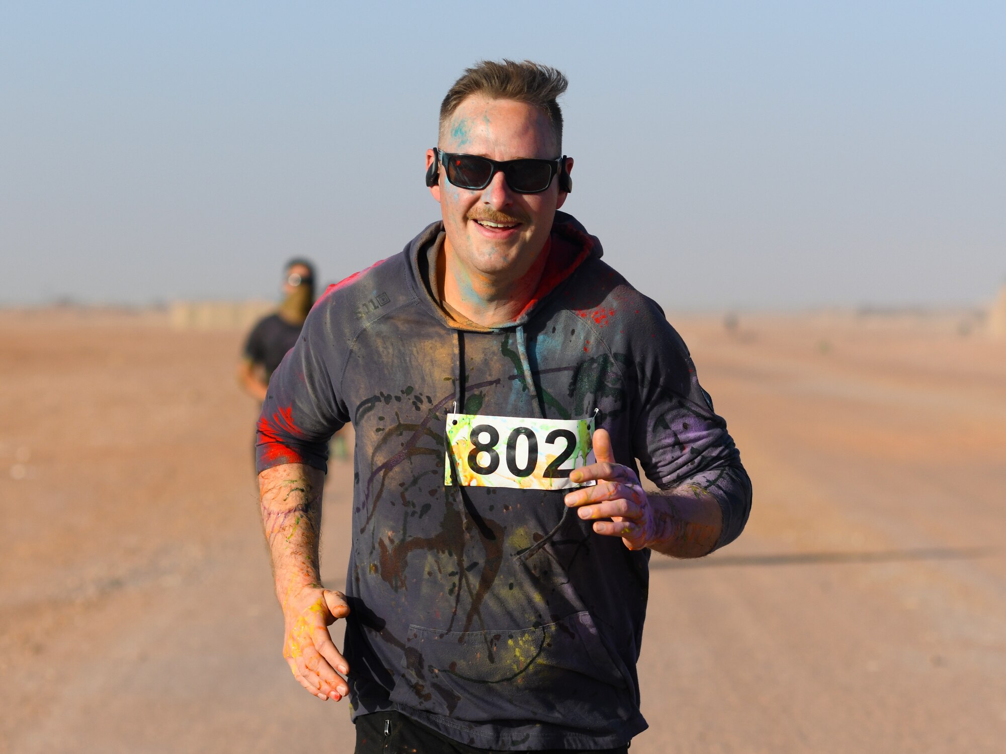 Participants compete in a color run at Nigerien Air Base 201, Niger, Feb. 2, 2020. More than 30 runners and volunteers participated in the event. (U.S. Air Force photo by Tech. Sgt. Alex Fox Echols III)