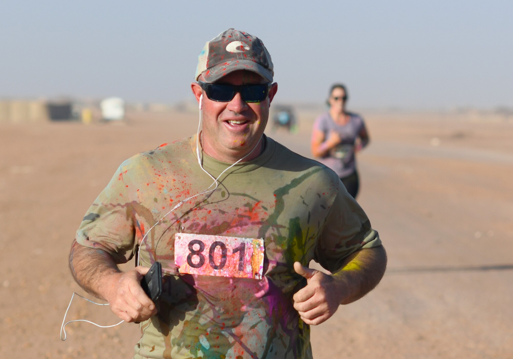 Participants compete in a color run at Nigerien Air Base 201, Niger, Feb. 2, 2020. More than 30 runners and volunteers participated in the event. (U.S. Air Force photo by Tech. Sgt. Alex Fox Echols III)