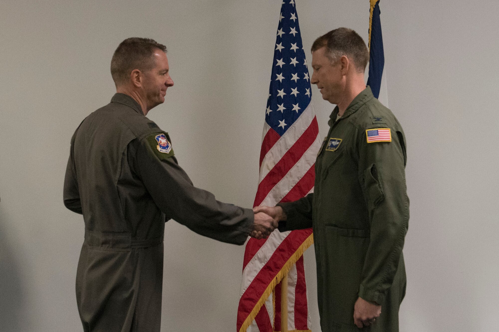 Col. Marty Timko, 167th Airlift Wing commander, congratulates Col. Christopher Sigler upon his assumption of command of the 167th Operations Group during a ceremony at the 167th Airlift Wing, Feb. 2, 2020.