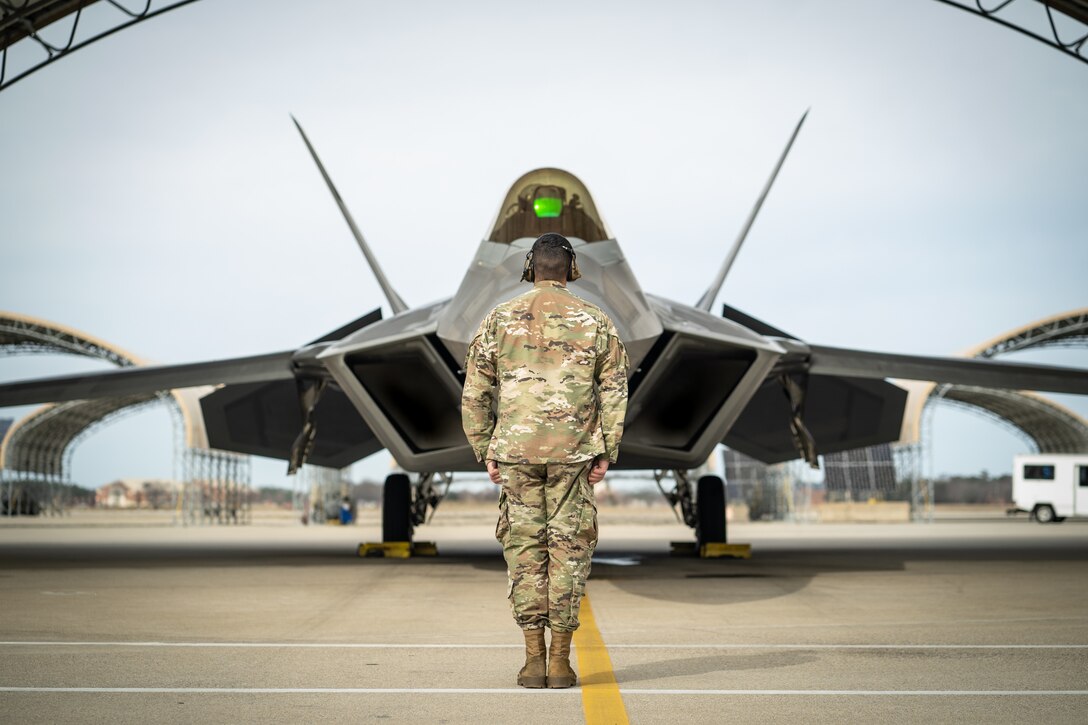 A U.S. F-22 Raptor assigned to the F-22 Demo Team prepares to be launched out by a crew chief at Joint Base Langley-Eustis, Va., Jan. 30, 2020.