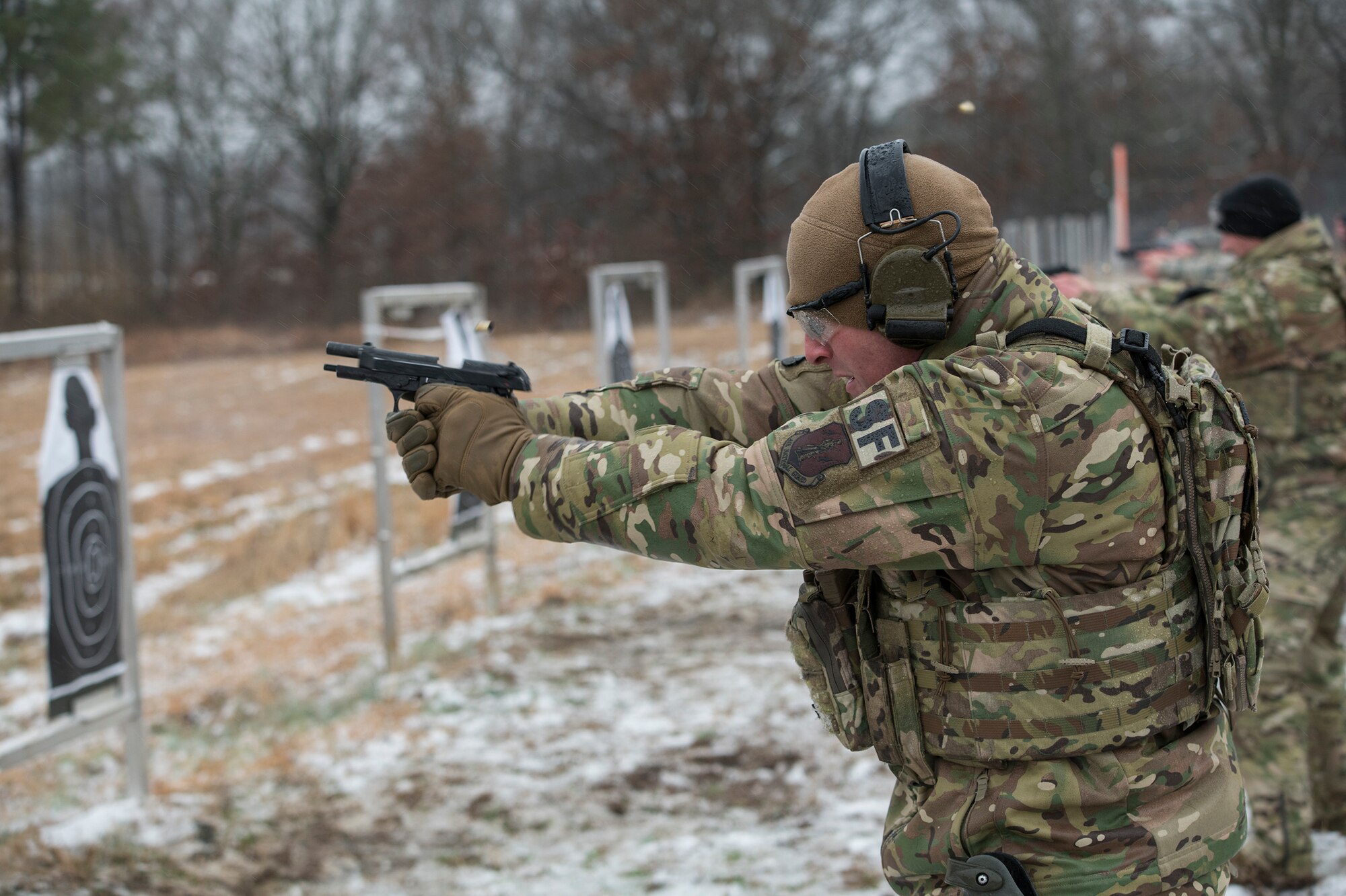 Master Sgt. Gregory Wardle, 153rd Security Forces Squadron, conducts pistol drills Jan. 22, 2020, at Ft. Chaffee, Arkansas. Wardle is part of the Air National Guard’s Defender Challenge team, composed of Airmen from across the ANG who gathered at Ft. Chaffee to train for the upcoming competition. (U.S. Air National Guard photo by Airman 1st Class Christopher Sherlock)