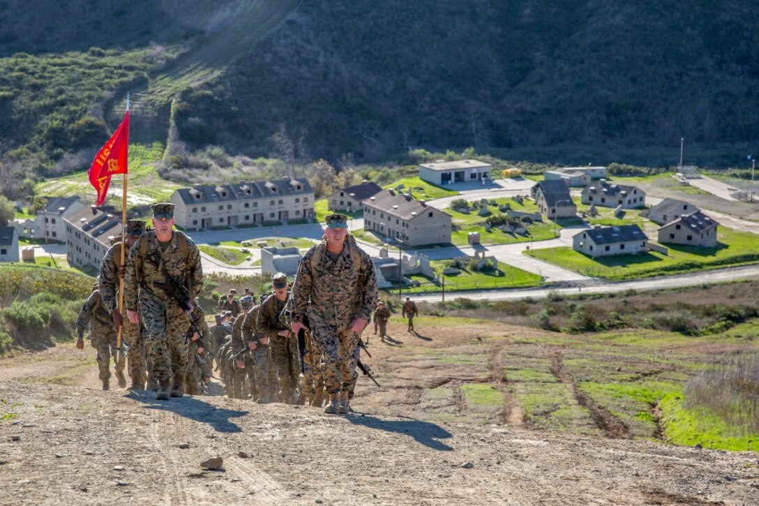 U.S. Marines with Headquarters Company, 13th Marine Expeditionary Unit, I Marine Expeditionary Force, conduct a conditioning hike at Marine Corps Base Camp Pendleton, Calif., Jan. 30, 2019.