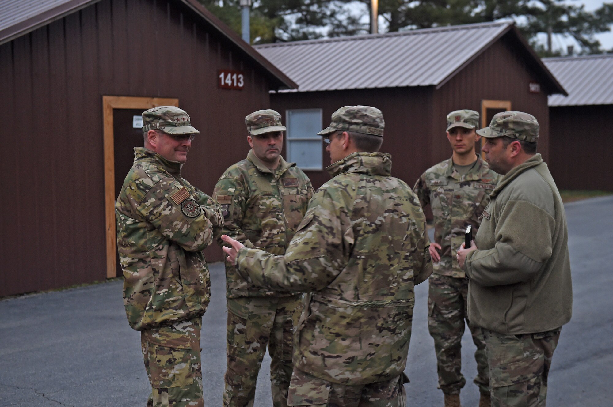 Airmen receive a briefing outside